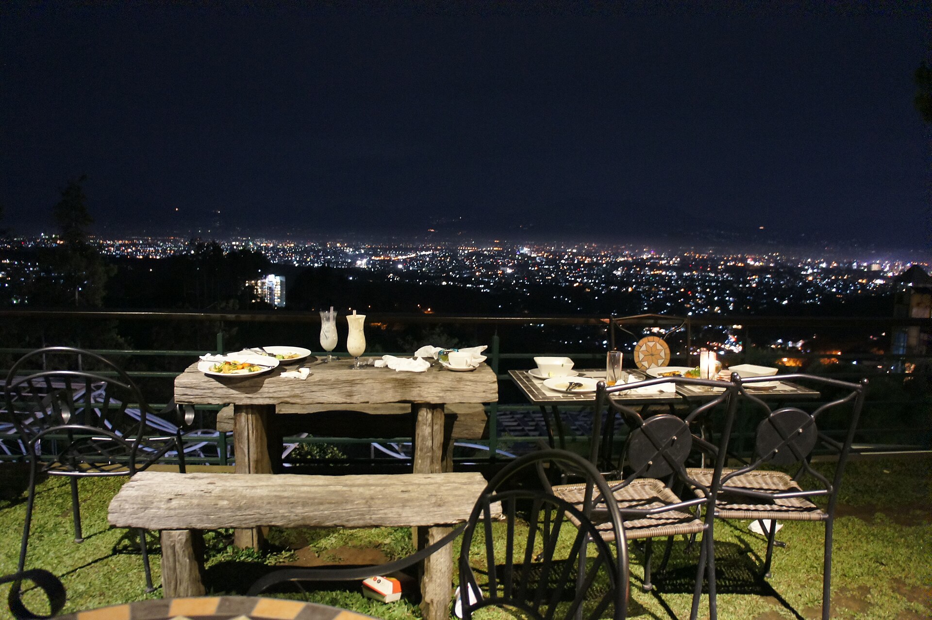 A hillside terrace overlooking the lights of Bandung