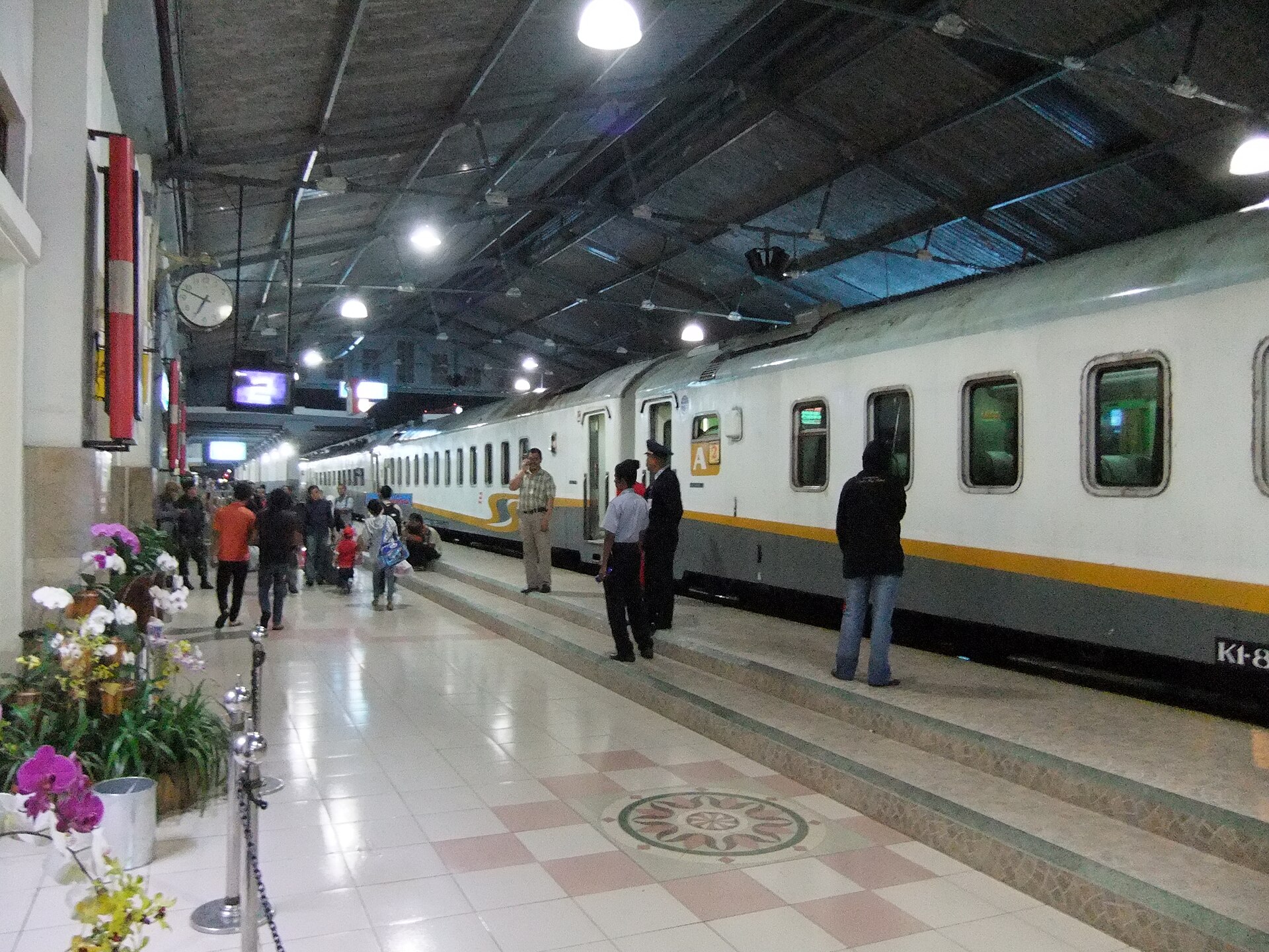 A train waiting beneath the lights of Bandung Station. Photograph by Midori, CC BY 3.0.